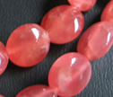 AA Rhodochrosite Smooth 10mm Puffy Coin Beads 
