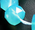 AAA Peruvian Chalcedony Faceted 9x6mm Wheel Hong Kong Cut